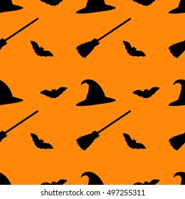 Halloween seamless pattern. Black silhouettes on orange/pumpkin color background. 