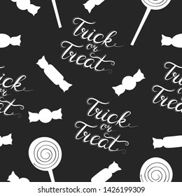 Halloween seamless pattern with candy and trick or treat phrase. Holiday wrap texture for kids.