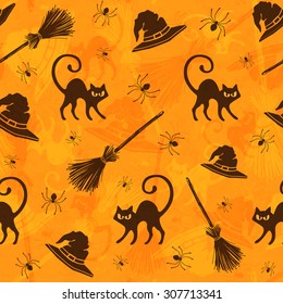 Halloween seamless pattern with cats, brooms and witch hats. 