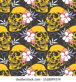 Halloween seamless pattern with colorful and scary skulls.Vector october background.Textile texture with skulls,flowers and leafs