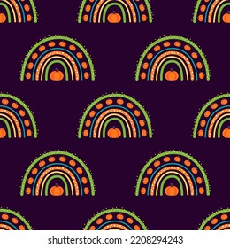 halloween seamless pattern of cute rainbows with pumpkins, vector illustration in flat cartoon style, perfect for fabric, package paper, wallpaper, greeting cards