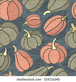 Halloween seamless pattern with dark grey and pink pumpkins on a dark blue background. Desaturated dark colors. Endless texture can be used for wrapping, packaging etc.