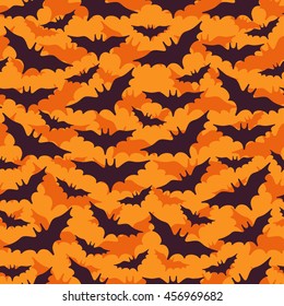 Halloween Seamless Pattern with Flying Black Bat Silhouettes on Orange Background. Vector Illustration. 