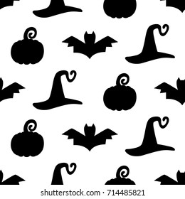 Halloween seamless pattern with hand drawn witch hats, pumpkins and bats doodles, isolated on white. Vector illustration for wrapping paper, textile.