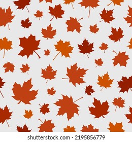 Halloween seamless pattern made up of many red and orange maple leaves on the white background for printing on wrapper, package, cloth, textile or cards. Endless repeating texture for autumn holidays.