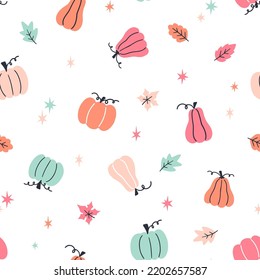 Halloween seamless pattern with pumpkins and colorful leaves. Vector design