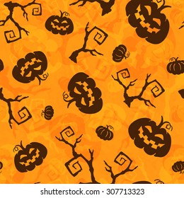 Halloween seamless pattern with pumpkins and tree brunches.