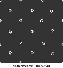 Halloween seamless pattern with skulls on a dark background. Scary wallpaper. Vector doodle image.