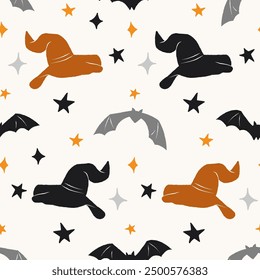 Halloween seamless pattern. Vector background with  stars, bats and witch hats.