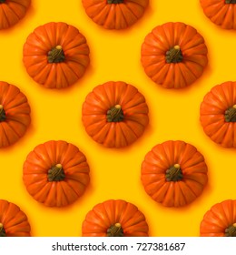 Halloween seamless pattern. Vector yellow Background with realistic pumpkins. Autumn illustration.