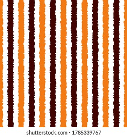 Halloween seamless striped pattern, vector illustration. Striped pattern with orange and brown vertical stripes. Halloween geometric background with rough lines