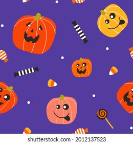 Halloween seamless vector pattern with cartoon pumpkins and sweets on a violet background. Festive vector texture for wallpaper, packaging, banners, printing products.