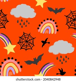 Halloween seamless vector repeat pattern in weather theme with rainbows, rain clouds, spider webs, bats and shooting stars on bright orange background. Trendy whimsical Halloween backdrop, non