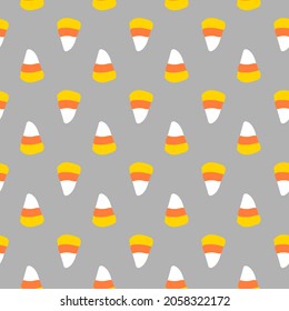 Halloween seamless vector repeat pattern with candy corn half drop on gray background