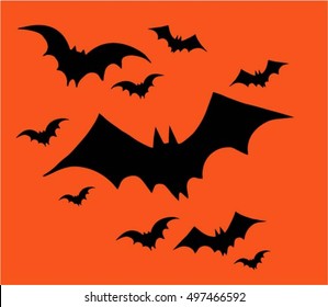 Halloween, set of bats  flying on a orange background