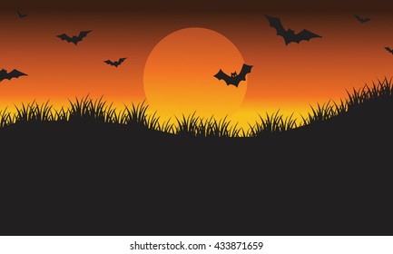 Halloween silhouette bat flying in the fields