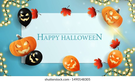 Halloween template for your creativity with paper sheet. blue template with Halloween balloons, pumpkins, autumn leaves and garland. The view from the top.