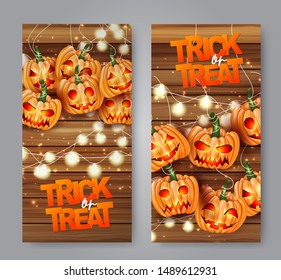 Halloween trick or treat flyer set with pumpkin creepy faces and lights garland over wooden board background. Vector illustration.