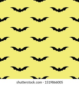 Halloween vector background with bats in yellow and black. Seamless pattern for fabric, textile, gifts, wallpaper and scrapbooking.