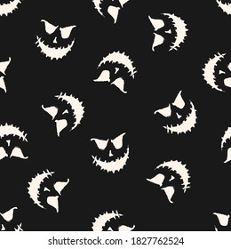 Halloween vector seamless pattern. Black and white abstract texture with scary pumpkin face, Jack o lantern silhouette. Simple monochrome repeat background. Creepy dark design for print, decor, wrap