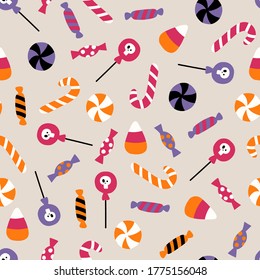 Halloween vector seamless pattern with candy. Pattern with sweets for Halloween. Flat illustration. For textiles, wrapping paper, gift paper, fabric.