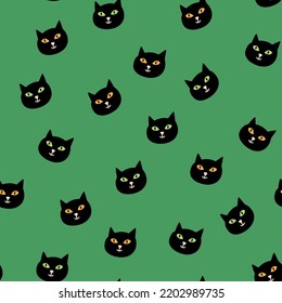 Halloween vector seamless pattern with cats heads