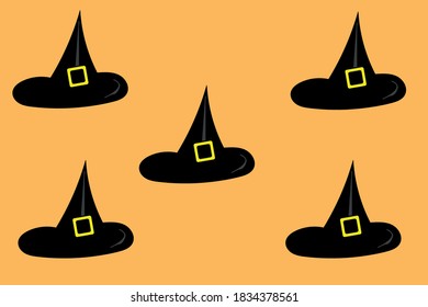 halloween witch hat over orange background