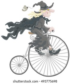 Halloween witch riding an antique bicycle