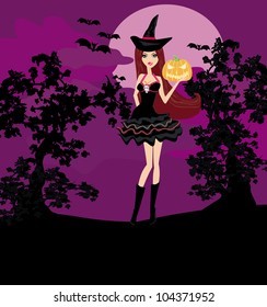 Halloween witch standing with pumpkin