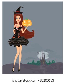 Halloween witch standing with pumpkin