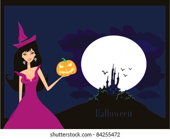 Halloween witch standing with pumpkin