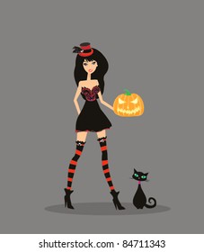 Halloween witch standing with pumpkin