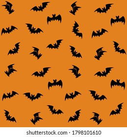 Haloween background with black bats on oragne. Haloween party card background template. Flock of bats. Fabric patterns