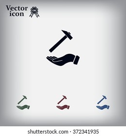 hammer in hand icon