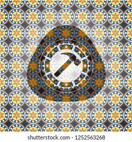 hammer icon inside arabic badge background. Arabesque decoration.