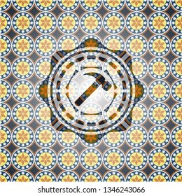 hammer icon inside arabic badge background. Arabesque decoration.