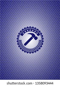 hammer icon inside badge with jean texture