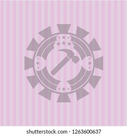 hammer icon inside badge with pink background