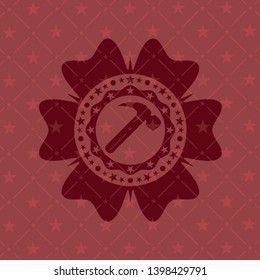 hammer icon inside badge with red background