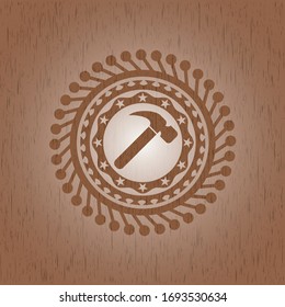 hammer icon inside badge with wooden background