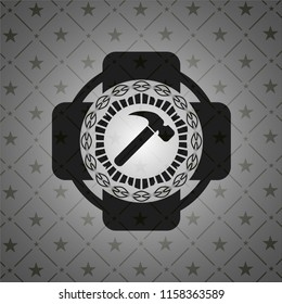 hammer icon inside black badge
