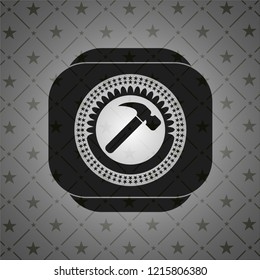 hammer icon inside black emblem