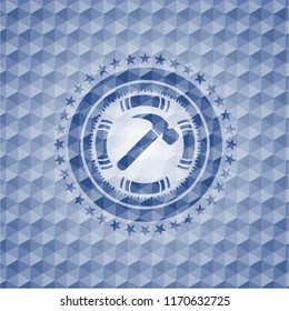 hammer icon inside blue emblem with geometric pattern.