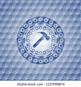 hammer icon inside blue emblem or badge with geometric pattern background.