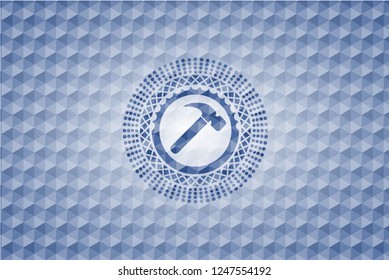 hammer icon inside blue polygonal emblem.