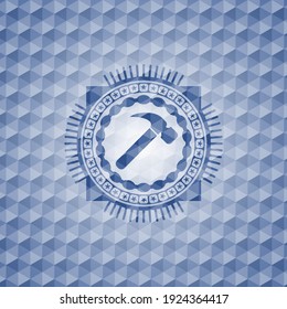 hammer icon inside blue polygonal badge. 