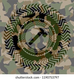 hammer icon inside camouflage emblem