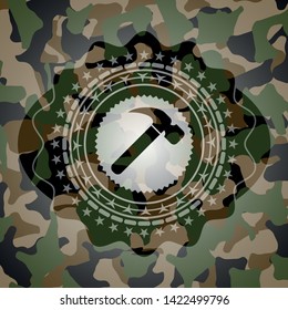 hammer icon inside camouflage texture