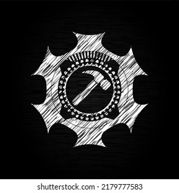 hammer icon inside chalk emblem. 