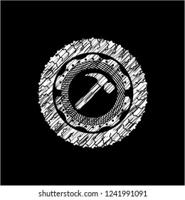 hammer icon inside chalkboard emblem